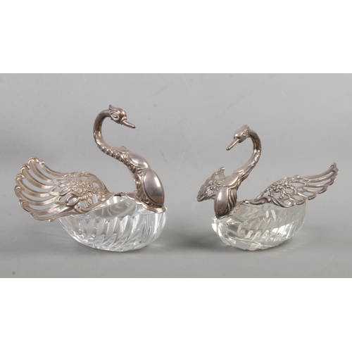 546 - Two cut glass and silver swan dishes, possibly salt sellers. With moving wings and pierced and scrol... 