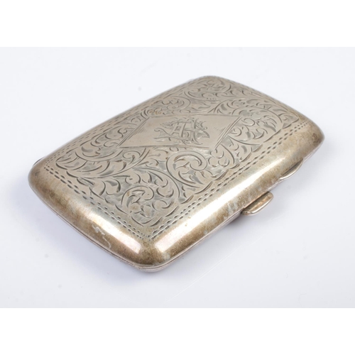 547 - A George V hinged silver cigarette case. With scrolled decoration and monogram cartouche. Assayed fo... 