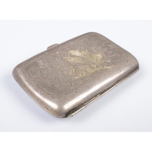 547 - A George V hinged silver cigarette case. With scrolled decoration and monogram cartouche. Assayed fo... 