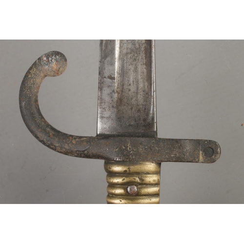 551 - A French M1866 bayonet with scabbard. Blade inscribed to edge and dated 1868. Blade length 57cm. CAN... 