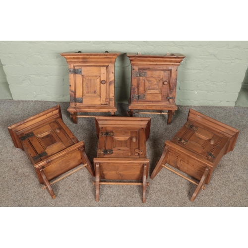 319 - Five small antique style pine wall mounting cabinets.