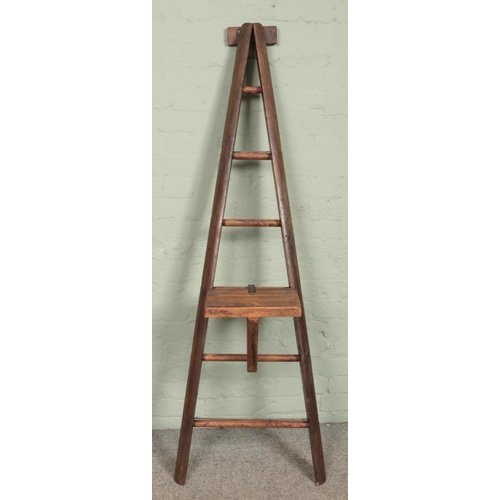 334 - A wooden 'A Frame' six rung ladder, possibly for fruit picking. With additional platform. Height 173... 