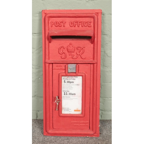 396 - A red painted George VI post box front. Makers mark for Carron Company, Stirlingshire.