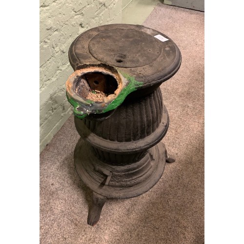 423 - A cast iron pot belly stove. (63cm)