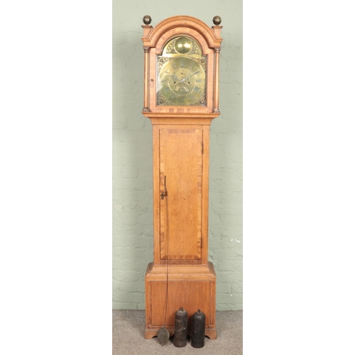 633 - A Nineteenth Century oak longcase clock, with brass dial labelled for James Todd, Bradford. Featurin... 