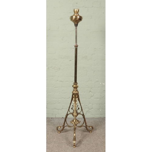 613 - A Victorian rise and fall adjustable brass oil standard lamp.