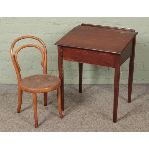 616 - A small stained pine child's desk with bentwood chair