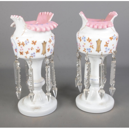 101 - A pair of cream and pink glass lustre vases with cut glass spike drops and hand painted floral desig... 