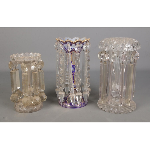 106 - A collection of single lustre vases all varying colour and shape, one with blue and gilt design.

Bl... 