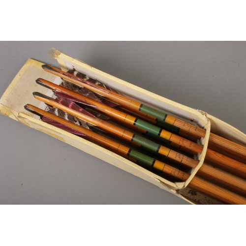 140 - An early 20th century set of 12 F H Ayres arrows marked 49 with a Maltese cross in the middle in ori... 