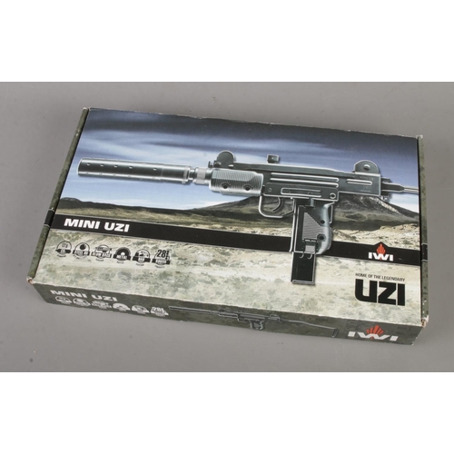 141 - A boxed IWI mini UZI Co2 steel BB gun.