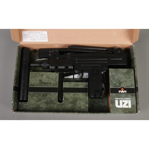 141 - A boxed IWI mini UZI Co2 steel BB gun.