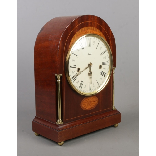 148 - A Rapport mahogany dome top mantel clock with fan patera inlay. Movement stamped for W Haid, Germany... 