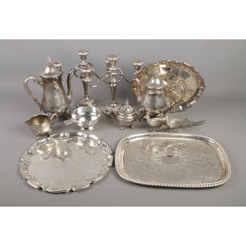 163 - A collection of silver plate and other metalwares including candle sticks, teapots and jugs, trays e... 