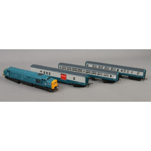 169 - A collection of OO gauge Tri-ang locomotives and carriages including a D6830, M14052, M30224and M152... 