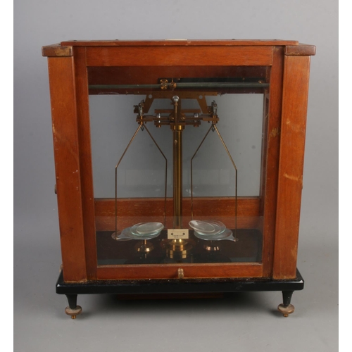 170 - A set of Stanton Morden scientific chemical scales in glazed mahogany case 

Hx46cm