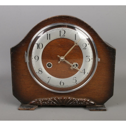 196 - An Andrew oak cased mantle clock featuring Perivale movement.