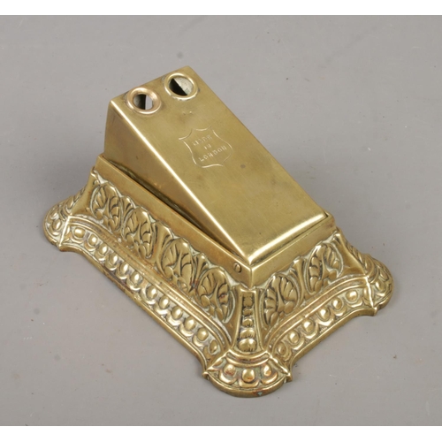 206 - An early 20th century brass desk top cigar cutter. Marked 'Made In London' to top.