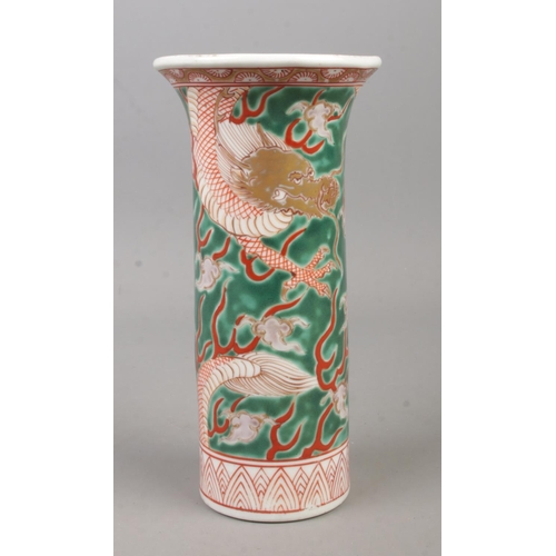 208 - A mid 20th century Chinese sleeve vase decorated in coloured enamels with dragons. Height 18cm.