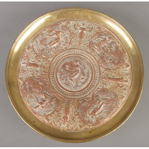 230 - A late 19th century brass and copper tazza. With central panel depicting Temperantia, surrounded by ... 