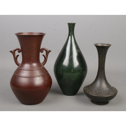 231 - Three Chinese bronze vases, all bearing marks to base. Tallest 24cm.