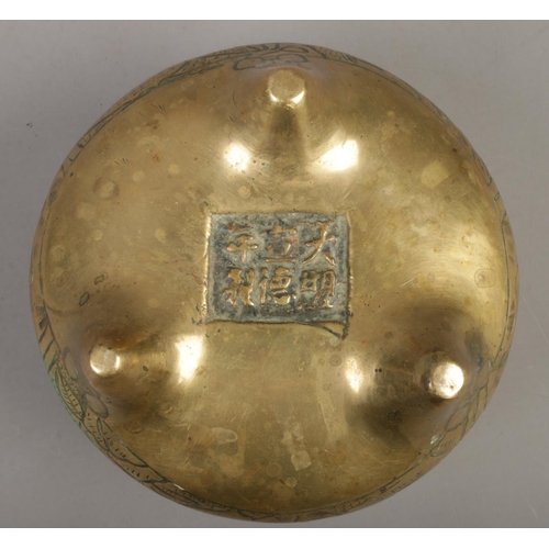 232 - A Chinese bronzed censor with impressed character marks to base. Diameter 12.5cm.