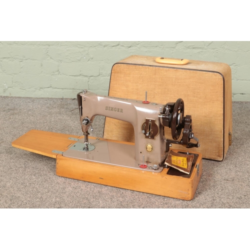 296 - A cased Singer 201K sewing machine.