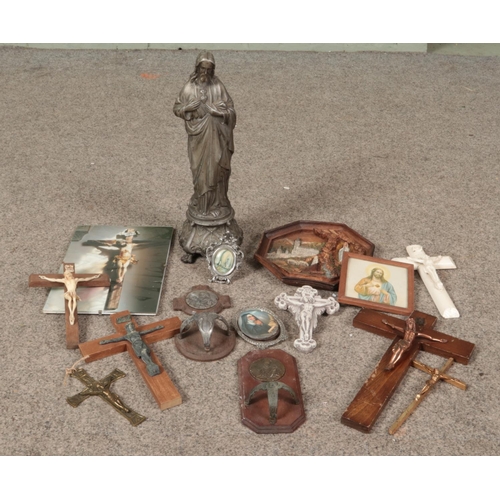 305 - A box of religious items. Includes cast metal sculpture of Jesus, crucifixes, pictures etc.