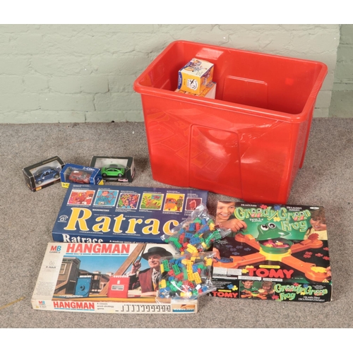 320 - A box of vintage toys, games and collectables to include Hangman, Diecast vehicles, chess set, jigsa... 