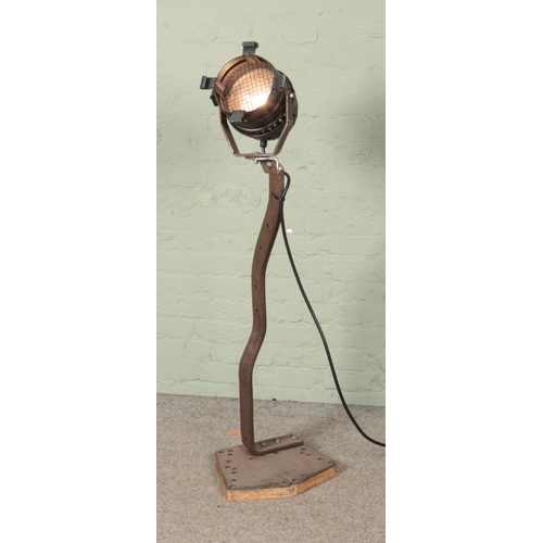 352 - A vintage theatre light with bespoke metal stand.