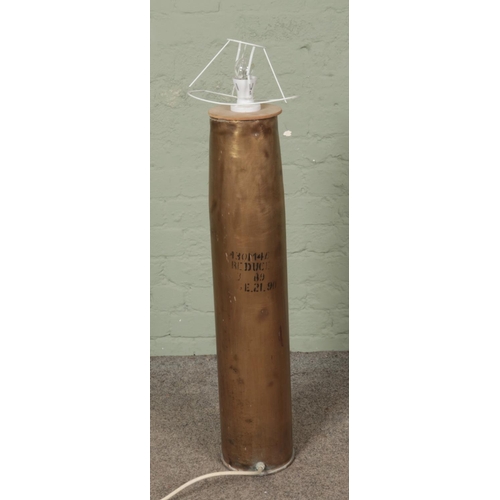 354 - A large artillery shell converted into a lamp.

Hx98cm