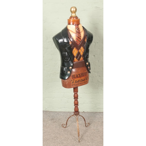 377 - A fibre glass Blackheat gold club mannequin dressed in vintage golf attire.

Hx159cm