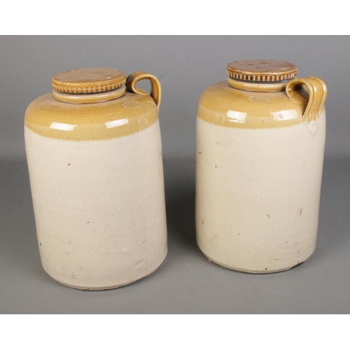 378 - A pair of large Richard Smiths Executors Acid Makers Glasgow stoneware flagons

Hx37cm