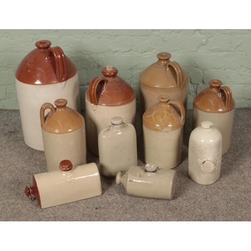 379 - A collection a mixed stoneware flagons and hot water bottles.