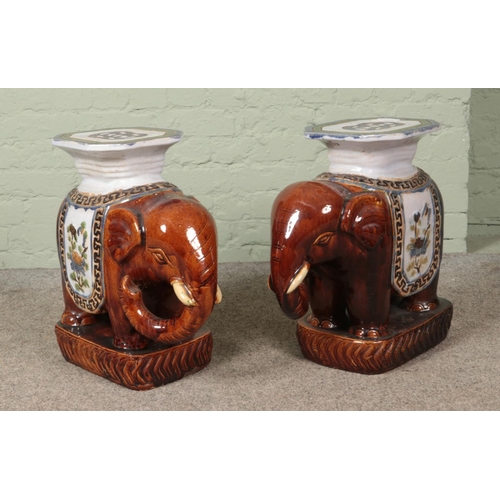 394 - A large pair of pottery elephant plant stands. Height 55cm.