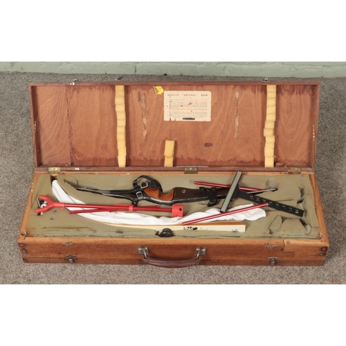 400 - An Apollo 'Kestrel' two piece steel bow housed in vintage double sided carry case. Includes various ... 