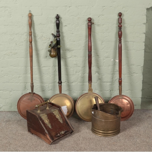 402 - Four Victorian brass/copper bed warming pans along with two coal scuttles.