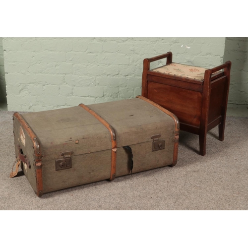 403 - A vintage wood bound travel trunk along with a mahogany stool.