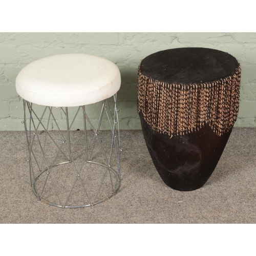 424 - An African hide drum along with a small leather topped stool.