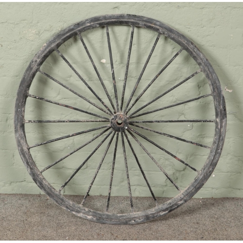 464 - A cast iron cart wheel with original rubber edging 

Diameter 95cm