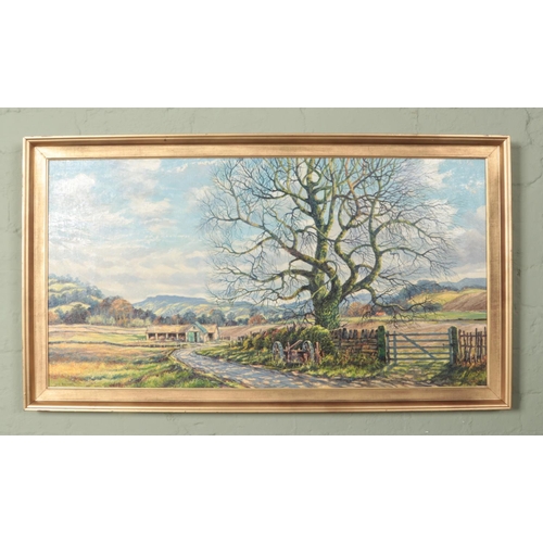 478 - John Spencer, a large gilt framed oil on canvas, rural landscape scene. 47cm x 90cm.