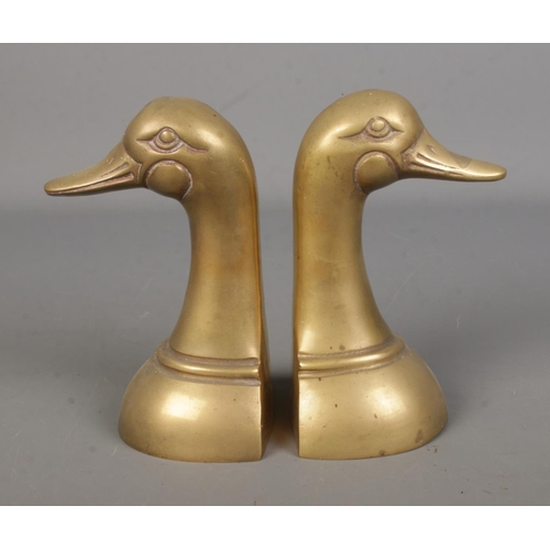 68 - Two novelty brass bookends formed as duck busts.