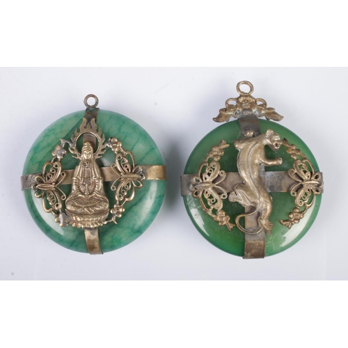 529 - Two similar Tibetan style pendants of white metal and jade colour design depicting a tiger and godde... 