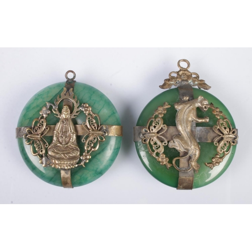 529 - Two similar Tibetan style pendants of white metal and jade colour design depicting a tiger and godde... 