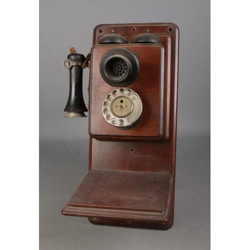 78 - An early 20th century wall mounted stick phone and bell box.