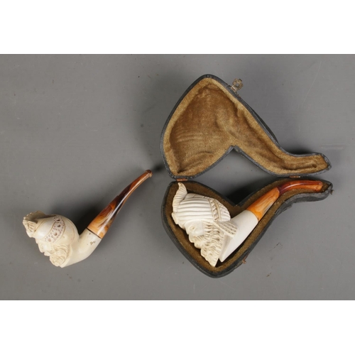 561 - Two carved figural Meerschaum pipes depicting bearded men wearing turbans with simulated tortoise sh... 