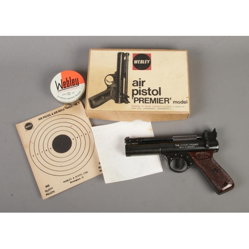 563 - A boxed Webley & Scott 'Premier' model .22 caliber air pistol. Includes tin of .22 pellets, target N... 