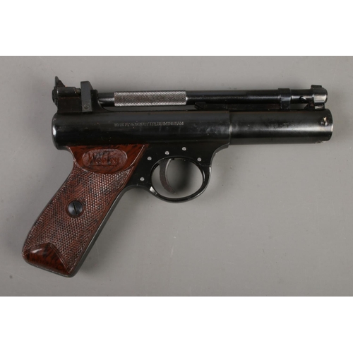 563 - A boxed Webley & Scott 'Premier' model .22 caliber air pistol. Includes tin of .22 pellets, target N... 