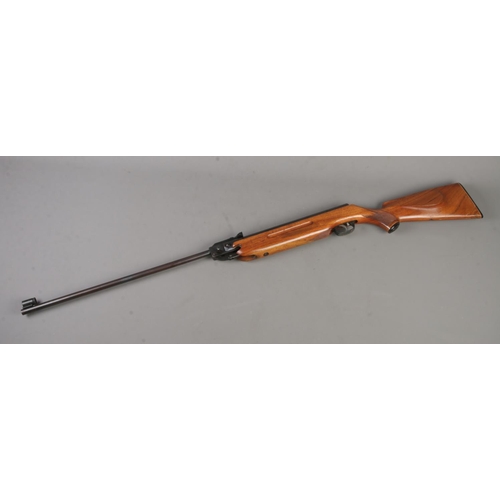 564 - A Weihrauch HW35 Export .22 caliber break barrel air rifle with walnut stock. CANNOT POST