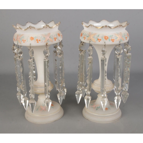 93 - A pair of white opaque glass lustre vases with hand painted floral design and cut glass spike drops.... 